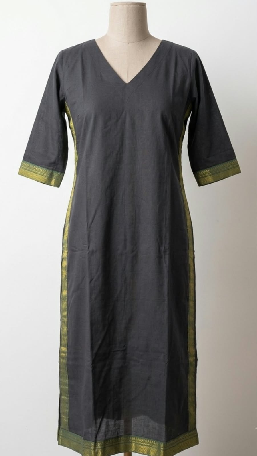 Everyday, considered: A simple charcoal shape with contrasting green details.